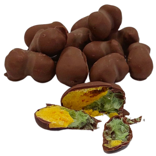 Pineapple chocolate coated freeze dried candy lollies